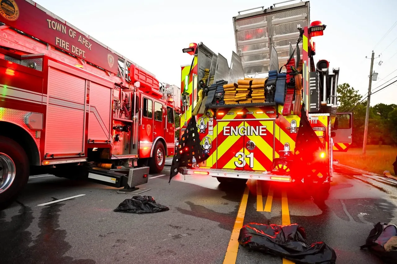 Apex Fire Department Engine 31 and a Town of Apex ladder truck at the scene of the Center Street house fire on Oct. 6, 2026.