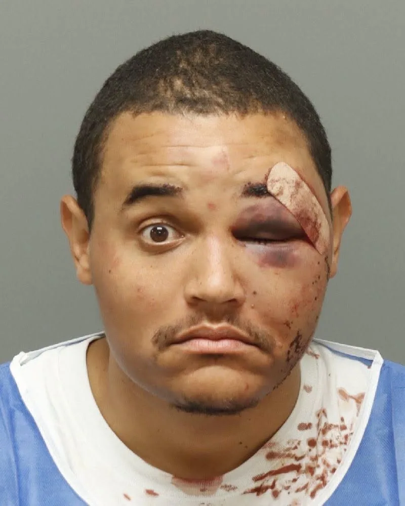 Booking photo of Christopher Andre Reed released by the Wake Forest Police Department.